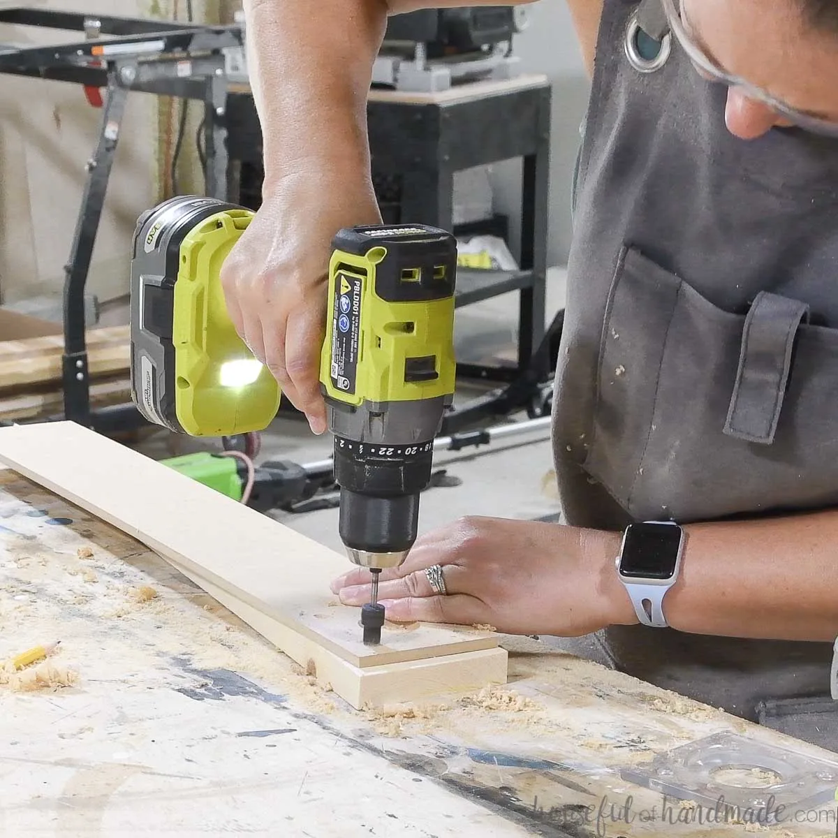 Drilling holes for screws in the MDF. 