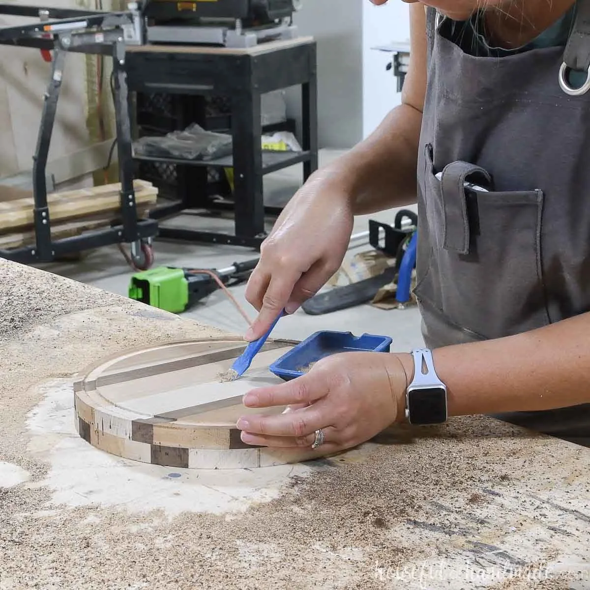 Filling the center hole with wood glue and sawdust mixed together. 