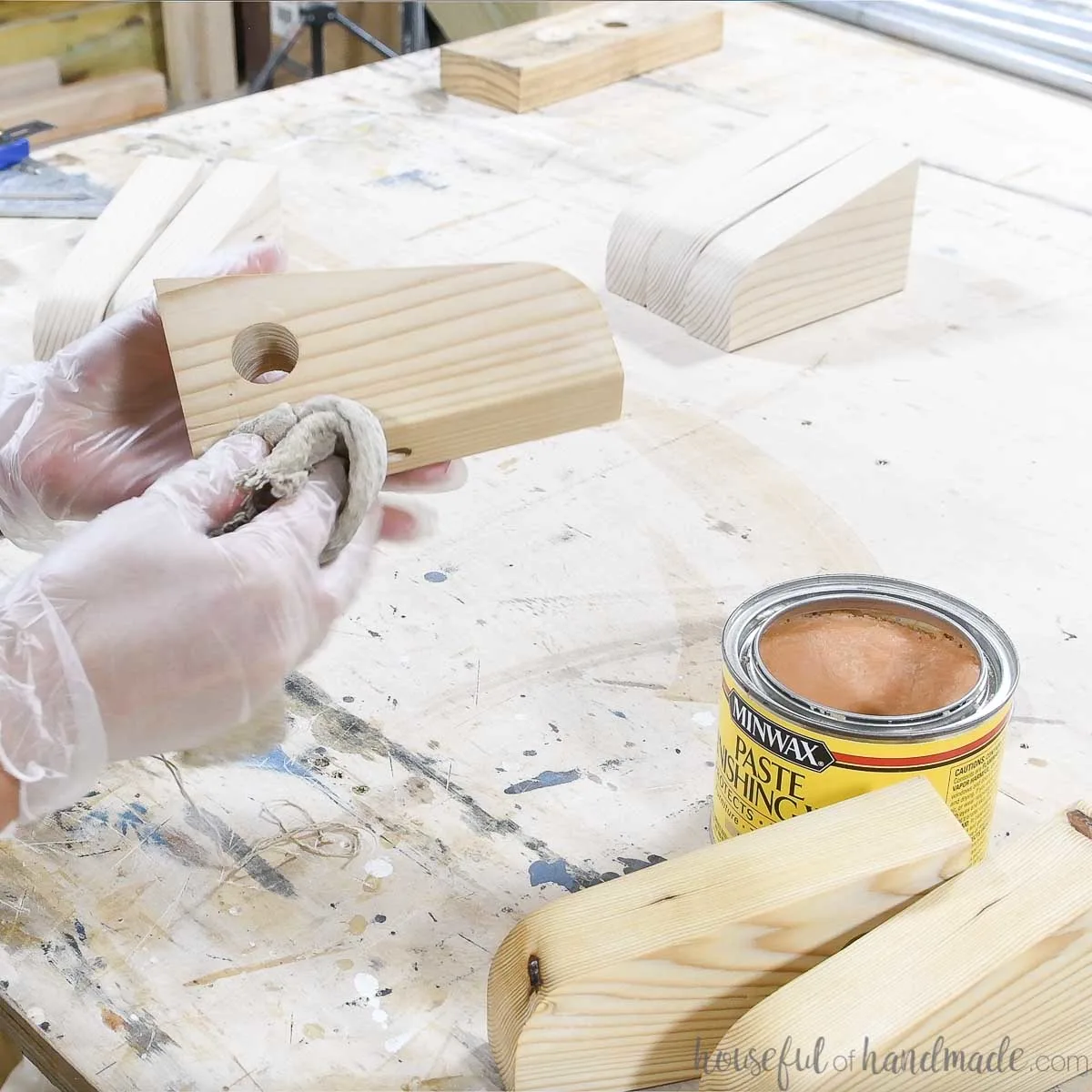 Sealing DIY curtain rod holders with furniture wax. 