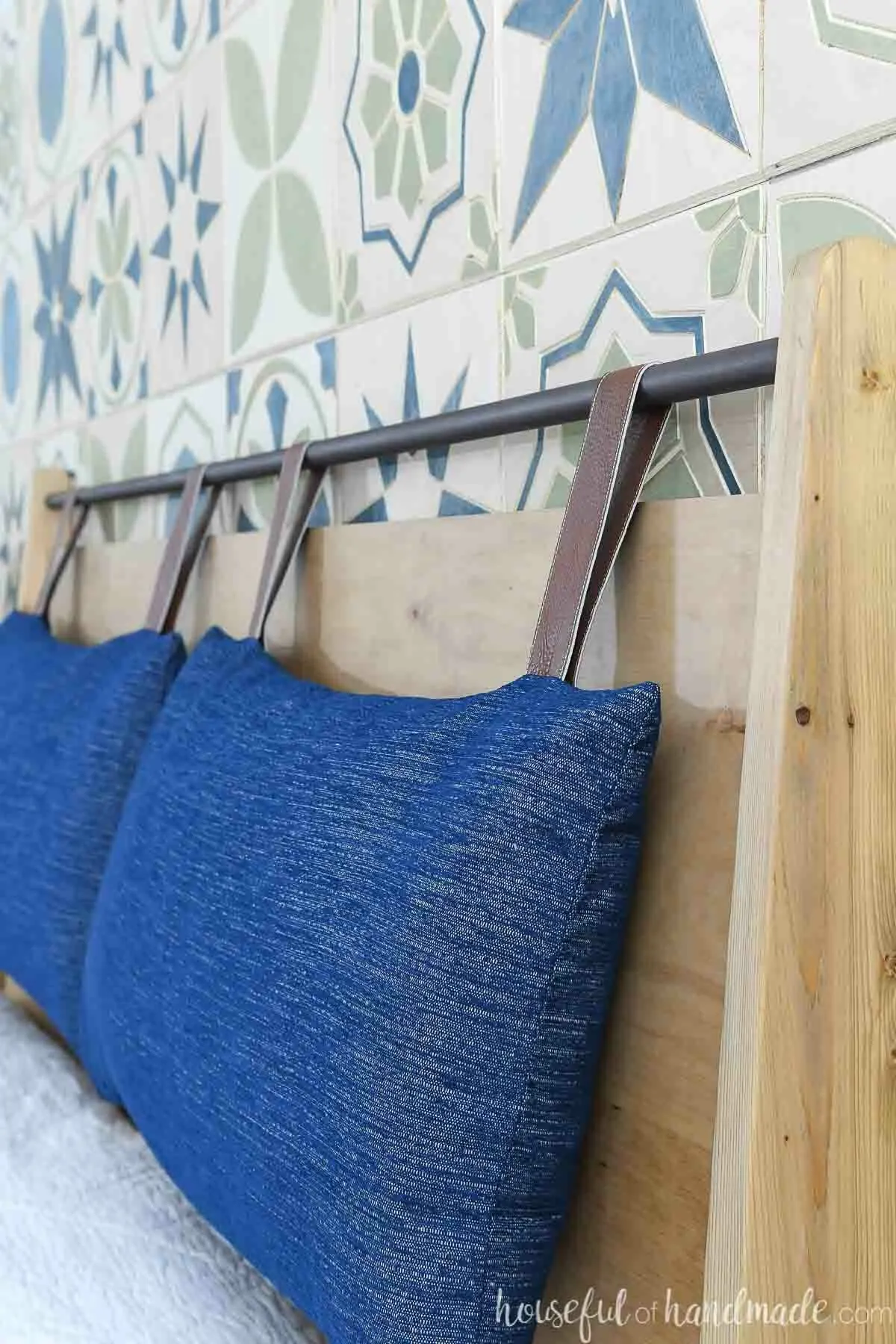 Close up of the headboard cushions made from pillows hanging on the modern headboard. 