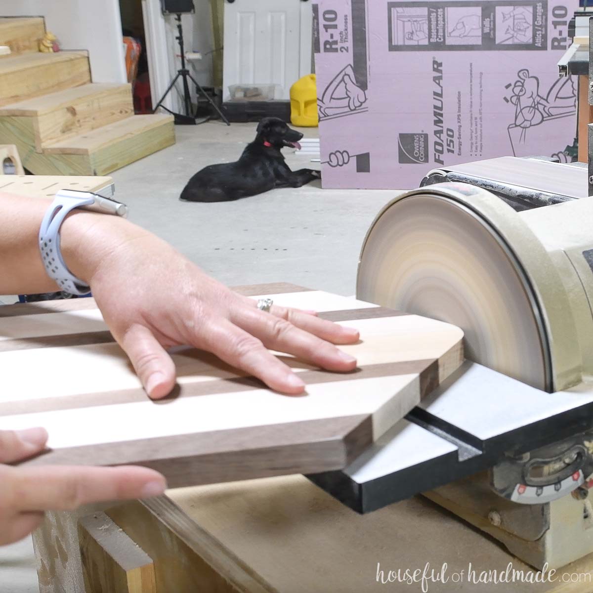 Sanding the top point into a curve with a disc sander. 