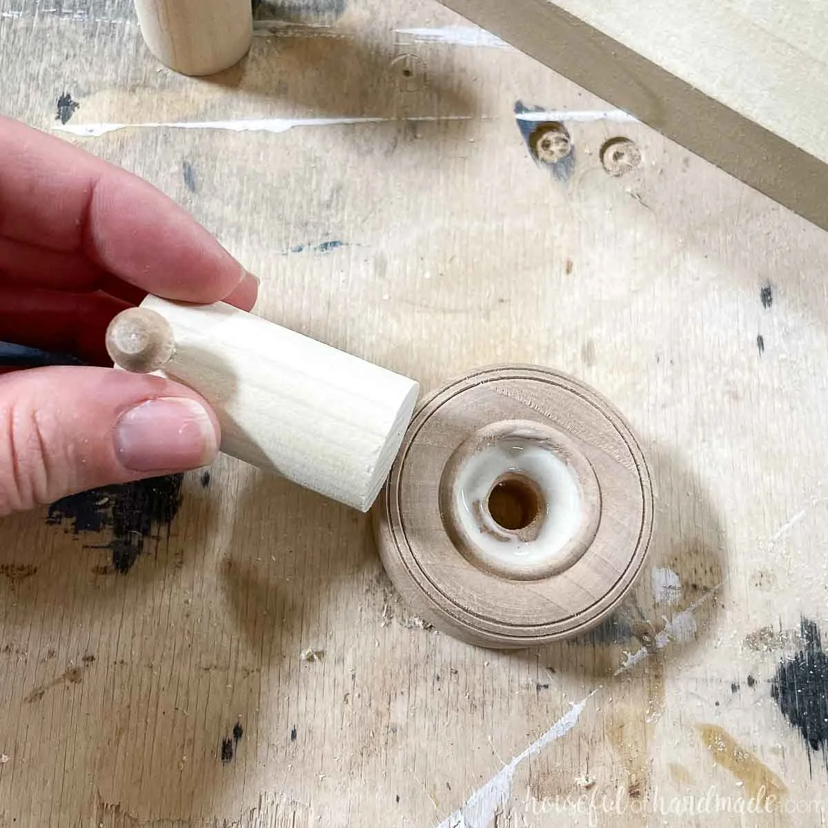 Glue in the center of the wood wheel before pressing the dowel into it. 