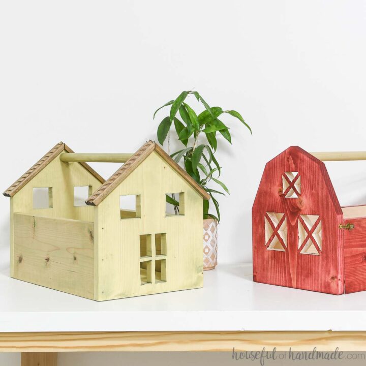 Two wooden toy totes, one that looks like a dollhouse and the other that looks like a barn.