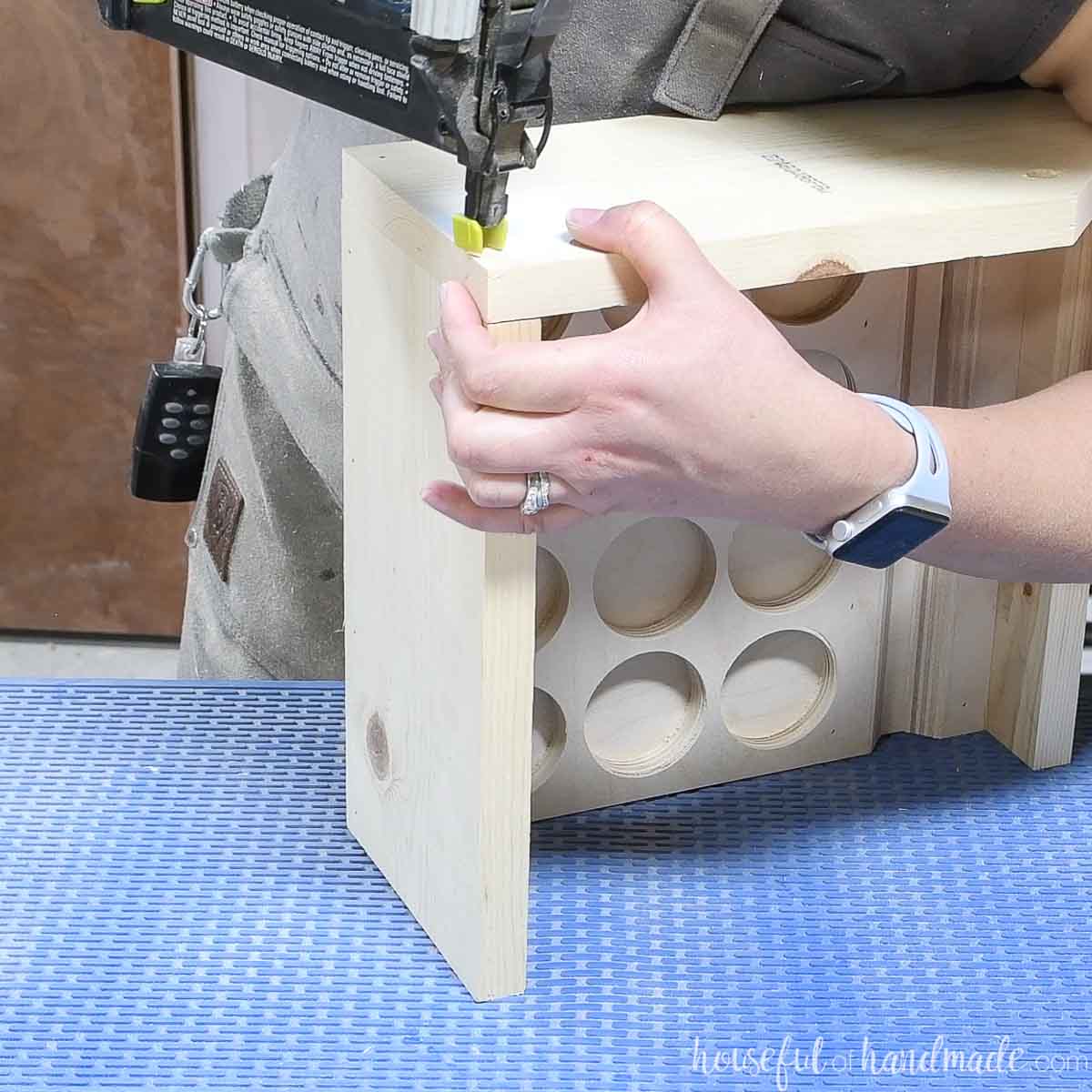 Attaching the sides to the carrier with a brad nailer. 