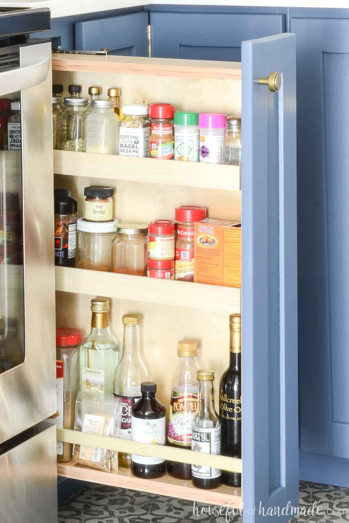 DIY pull out spice cabinet made from plywood.