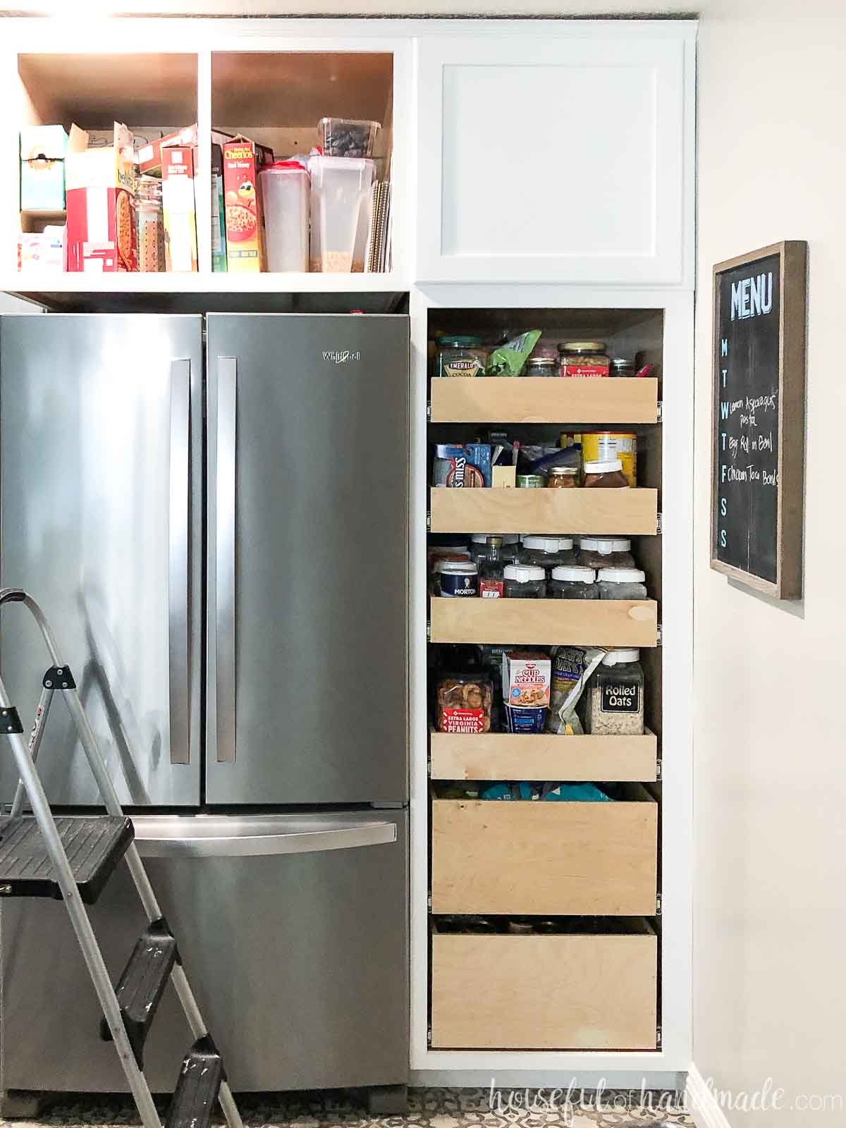 24" pantry cabinet with 6 pull out drawers inside it.