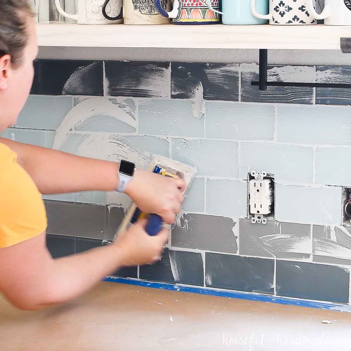 Removing excess grout with float at an angle.