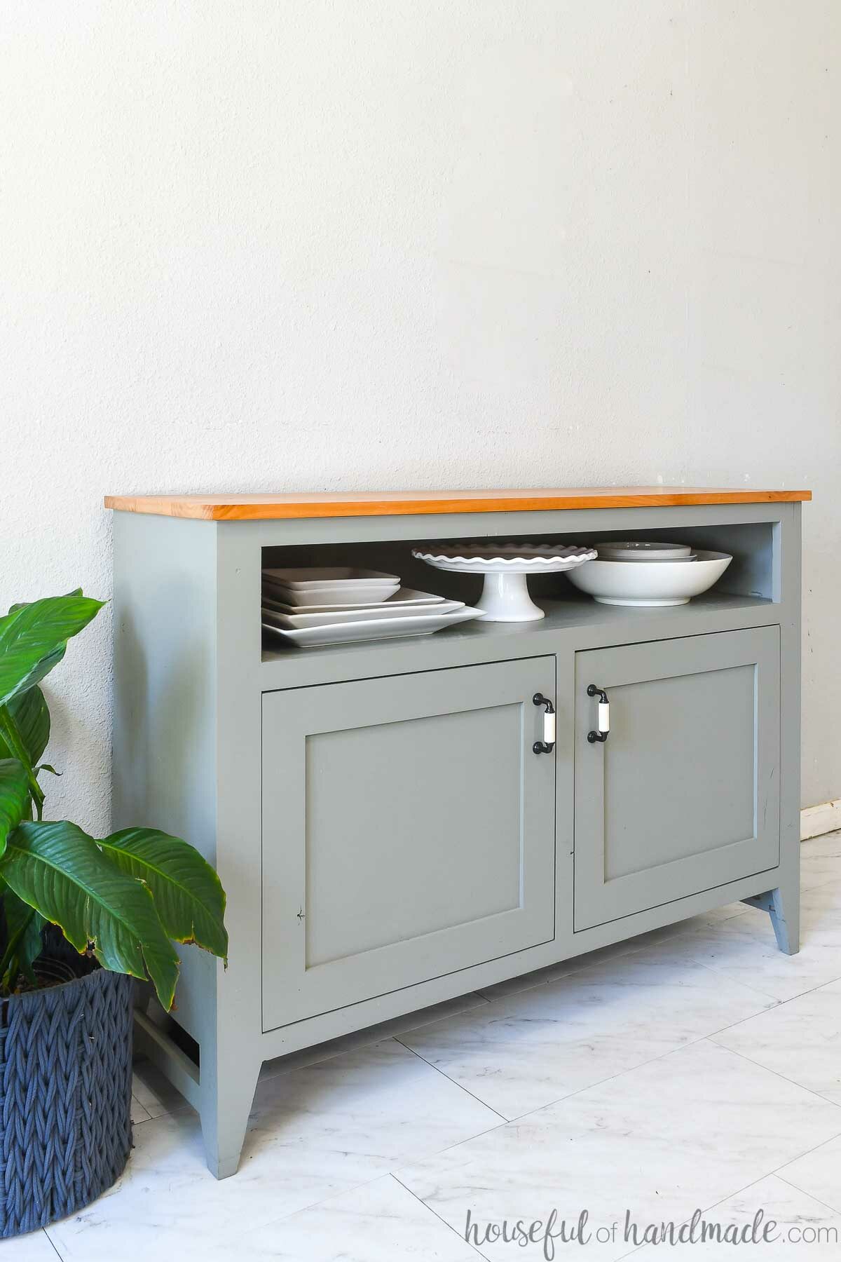 Painted sideboard buffet with natural alder wood top and a shelf for large dishes. 