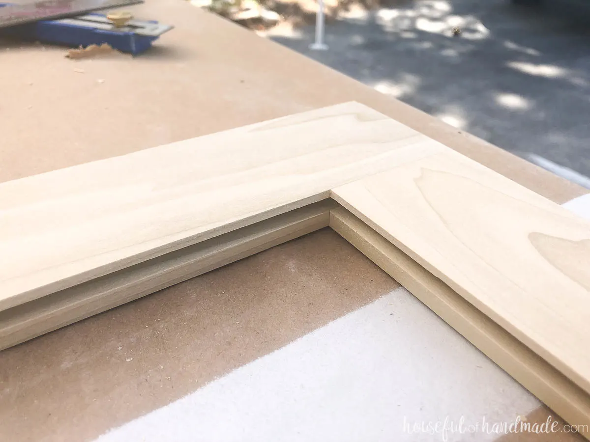 Close up of the groove for a center panel created in the routed cabinet door. 