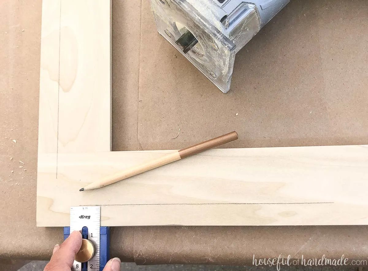 Marking a line around the perimeter of the door frame.