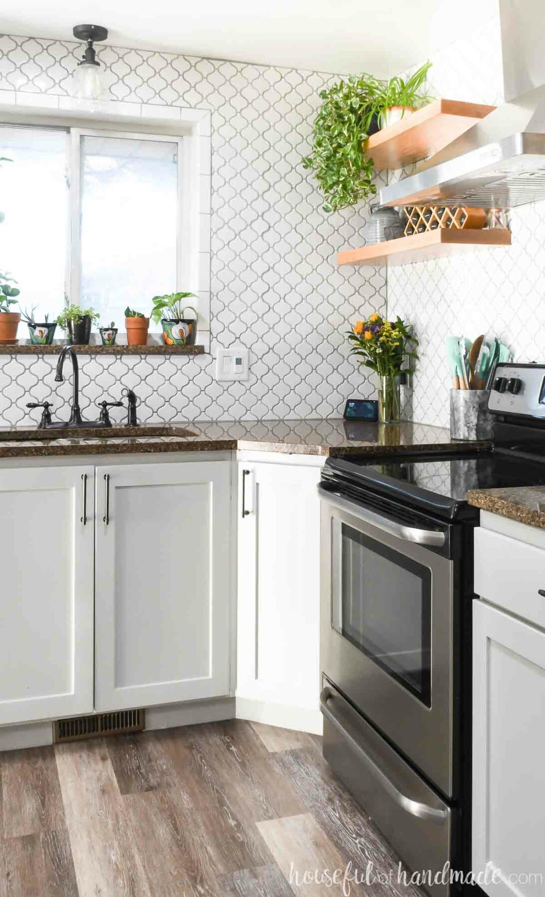 Modern kitchen with open shelves on the walls above diagonal base cabinet and stove. 