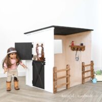DIY plywood dollhouse of a horse stable with 20