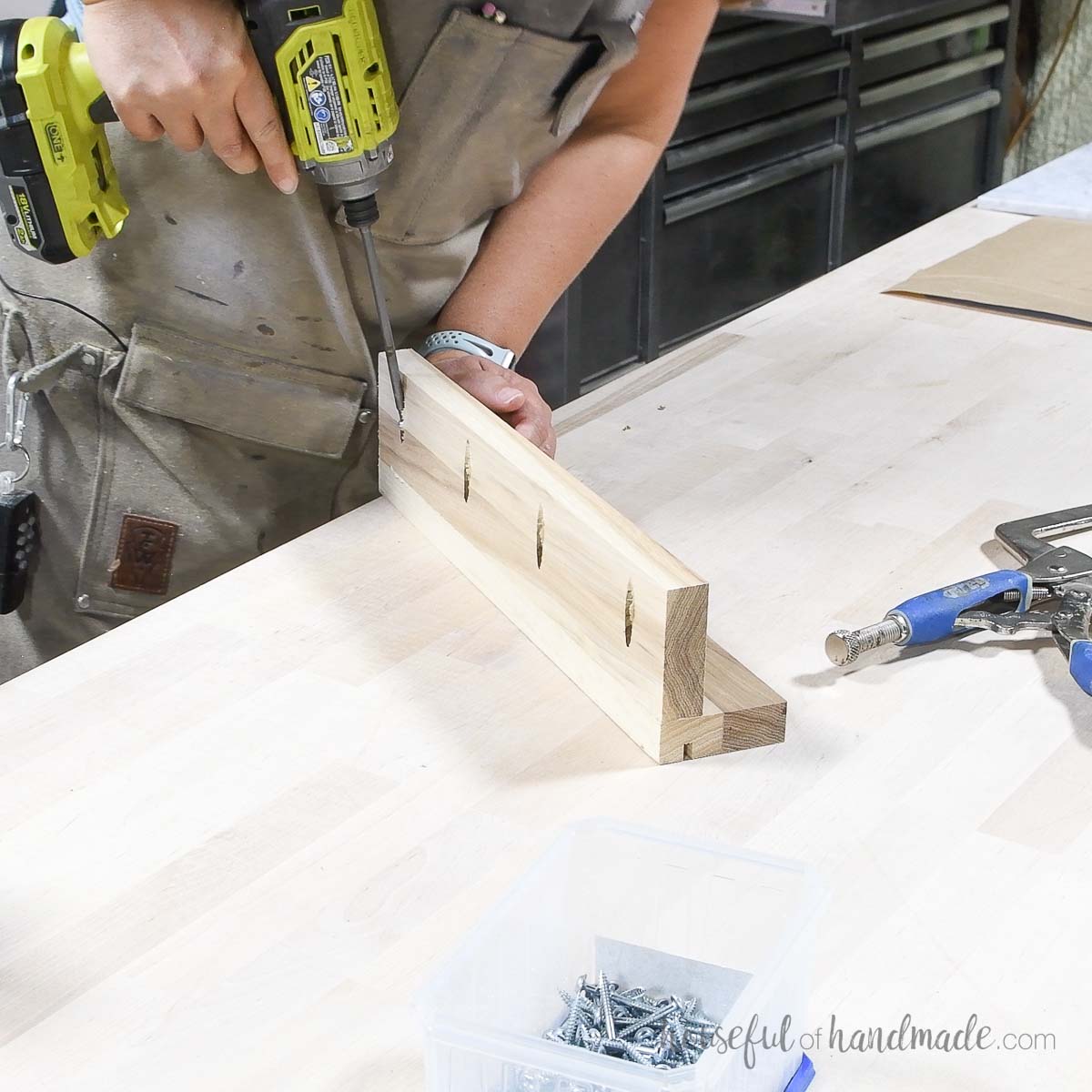 Attaching shelf pieces together with screws. 