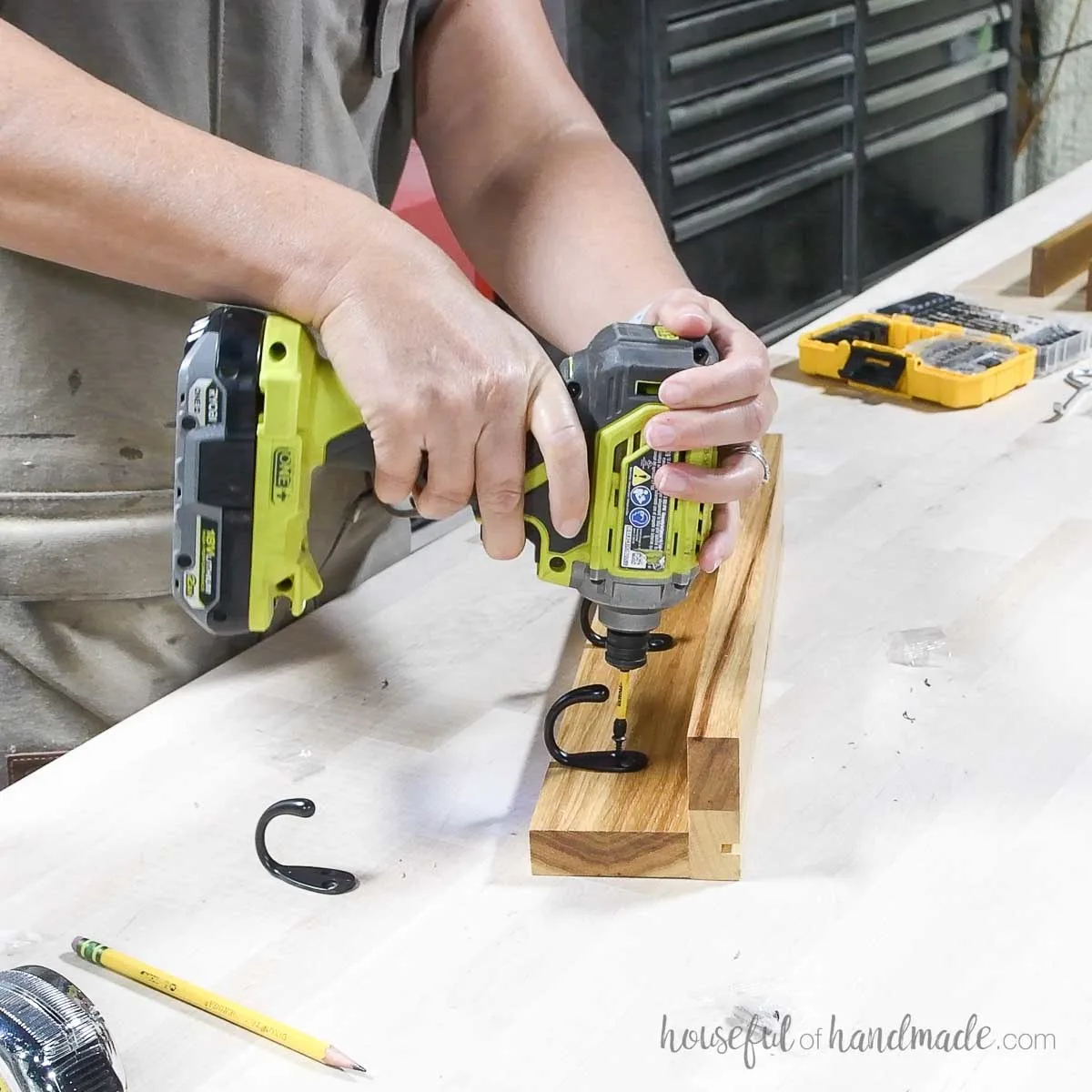 Adding hooks to the lower part of the entryway shelf. 