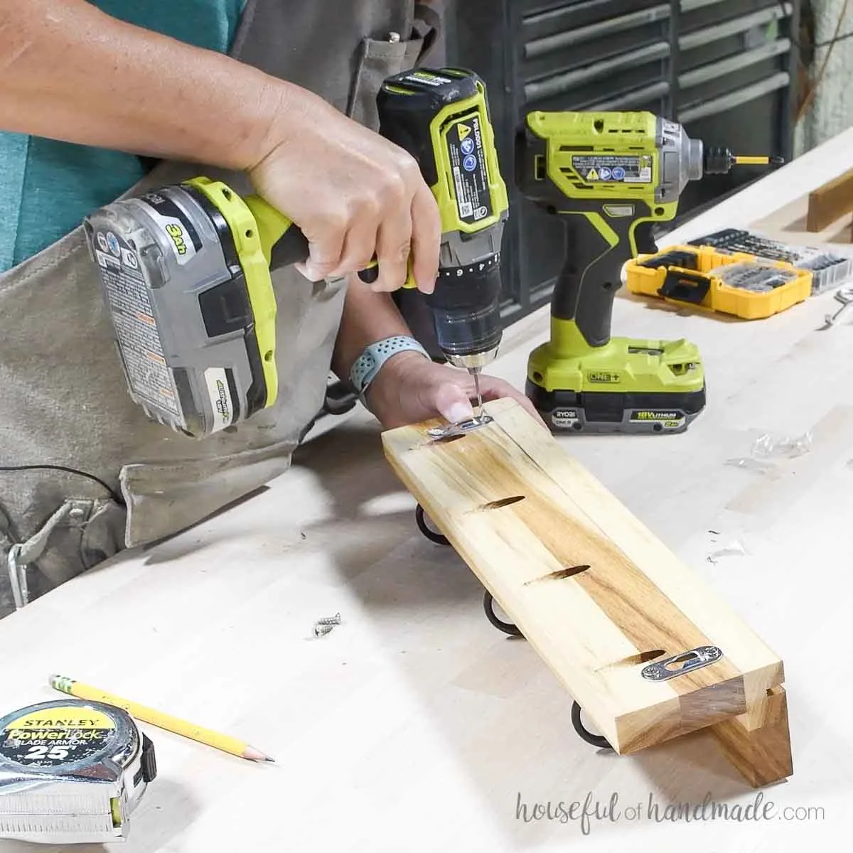 Attaching keyhole hangers to the back of the shelf to hang it on the wall. 