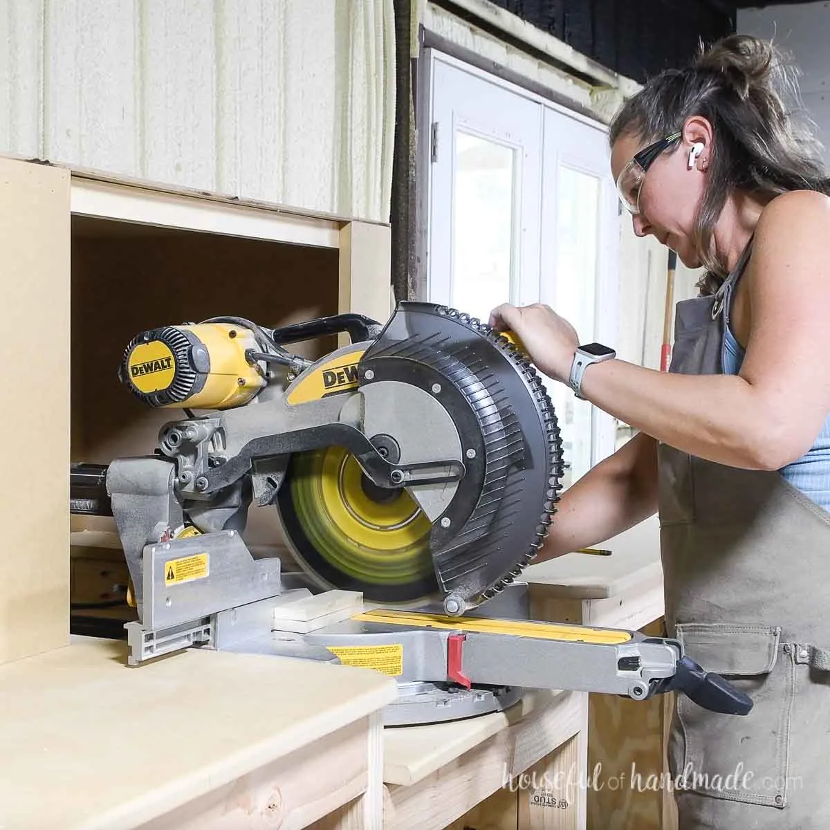 Cutting 2 pieces of wood stacked together on the miter saw.