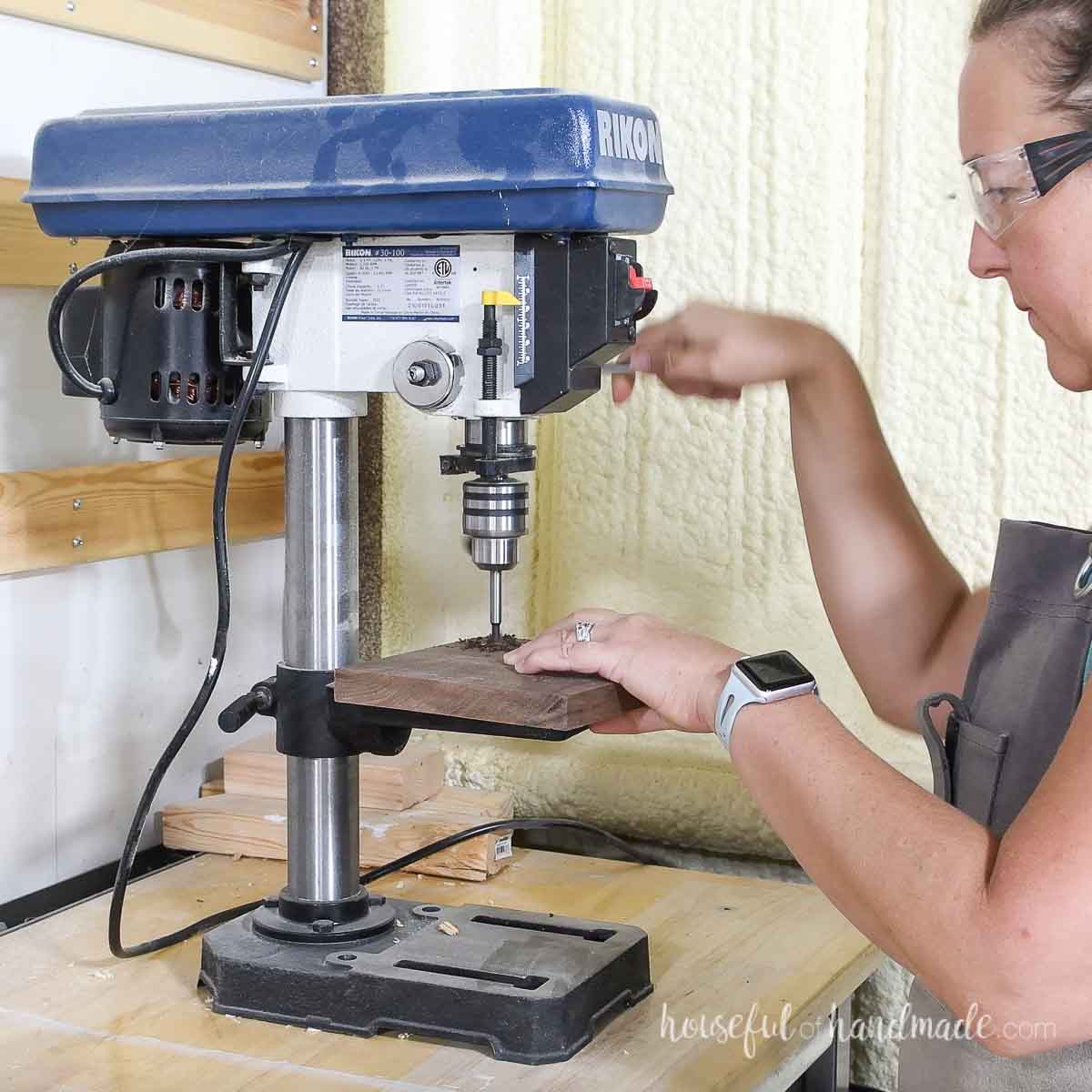 Drilling a hole on the drill press. 