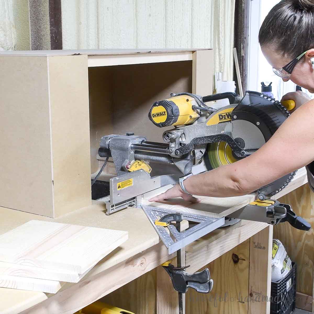 Cutting 1x12 boards on a miter saw.