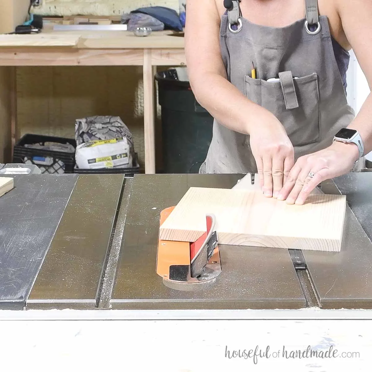 Cutting the board on the table saw at an angle with the miter gauge. 