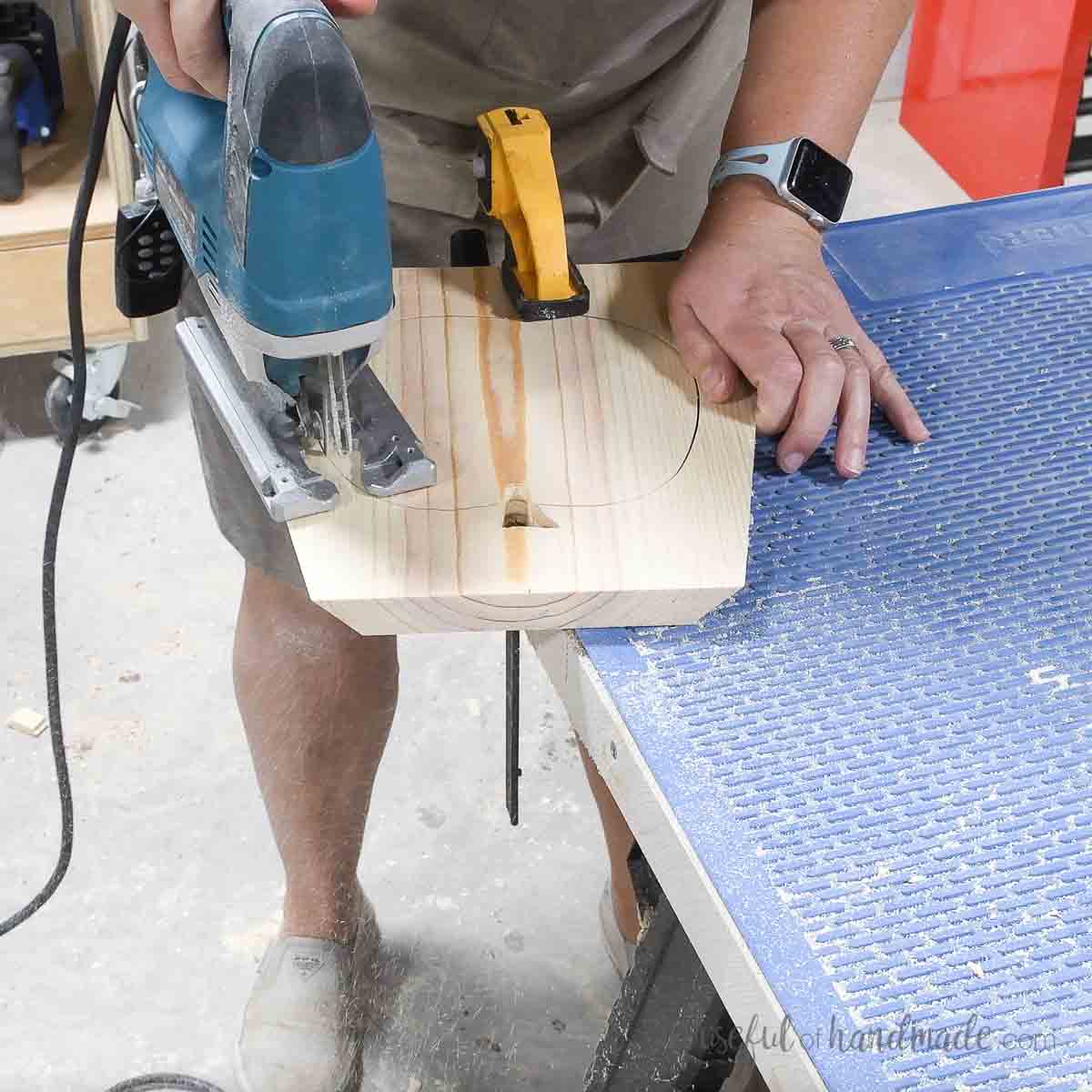 Cutting a pumpkin shape in the angled board with a jig saw. 