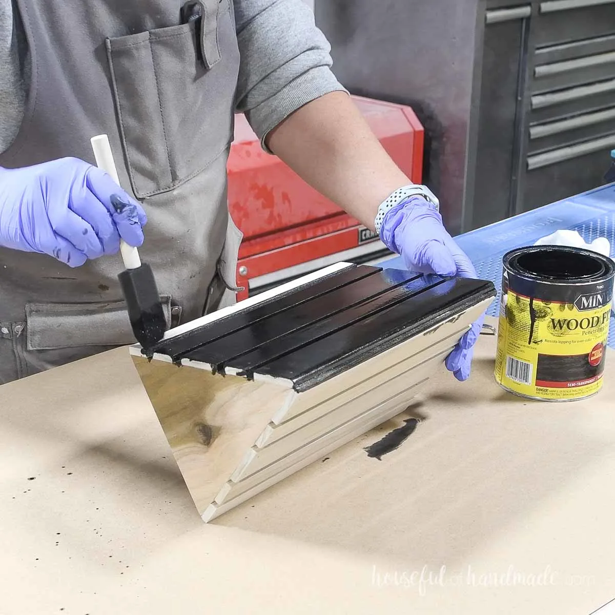 Staining the finished bookmark black.