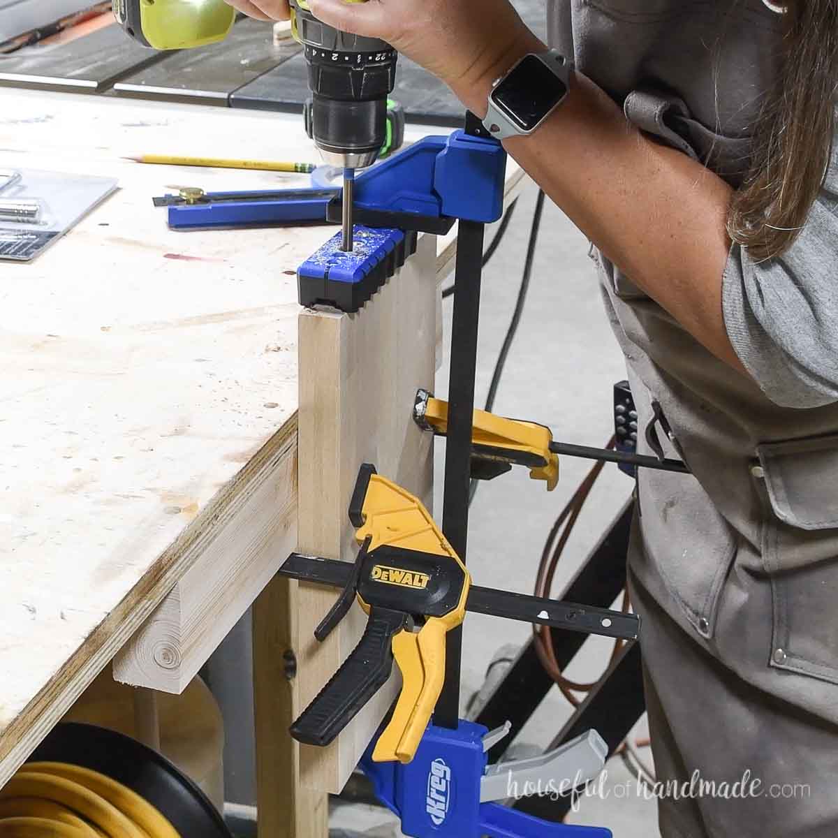 Drilling a hole with a long drill bit.