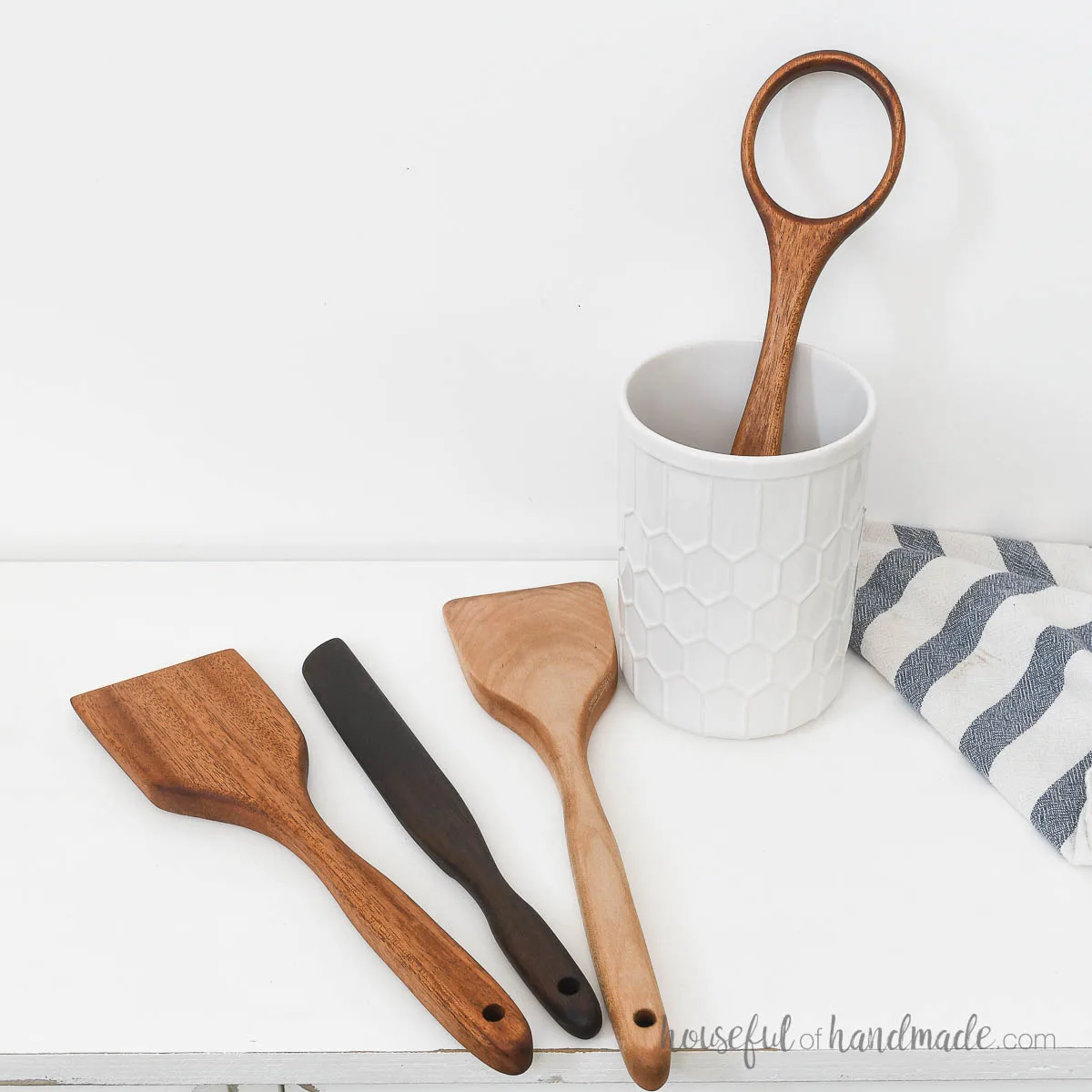 Four different types of DIY wood utensils from maple, mahogany and walnut wood. 