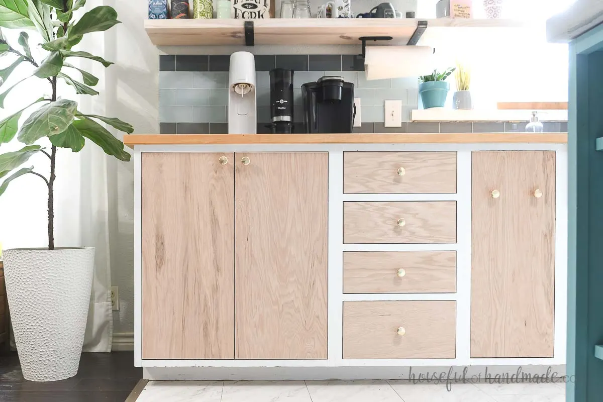 Kitchen with inset DIY plywood cabinet doors installed with concealed hinges.