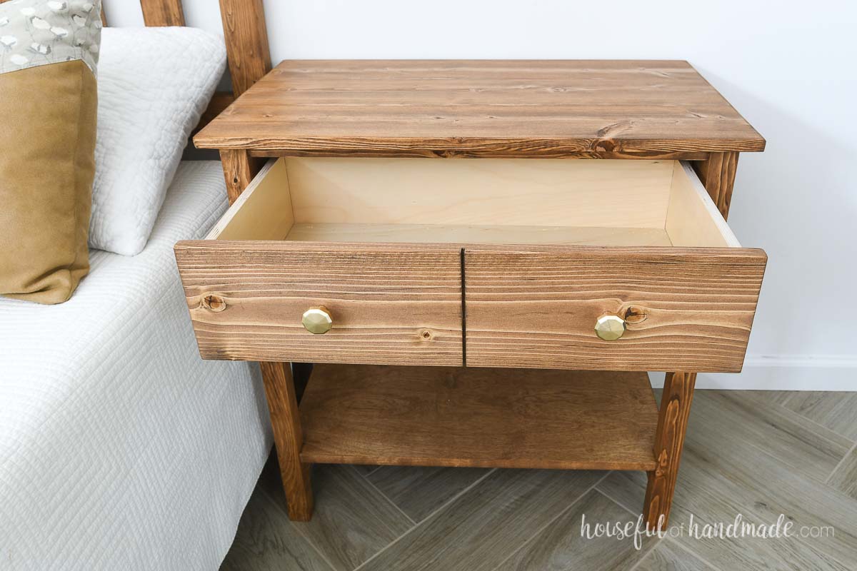Large drawer on the top of the nightstand open with a drawer front made to look like 2 drawers. 