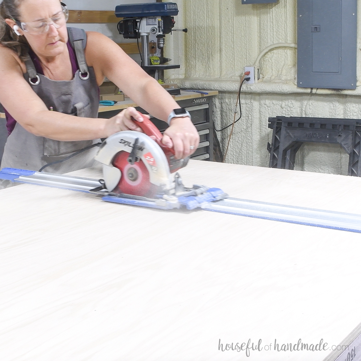 Cutting the first section of plywood off the squared up sheet. 