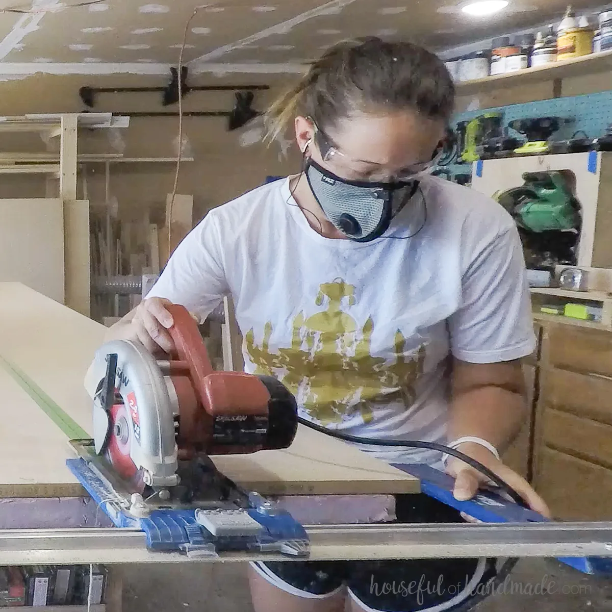Cutting a rip cut in plywood with an edge lip guide. 