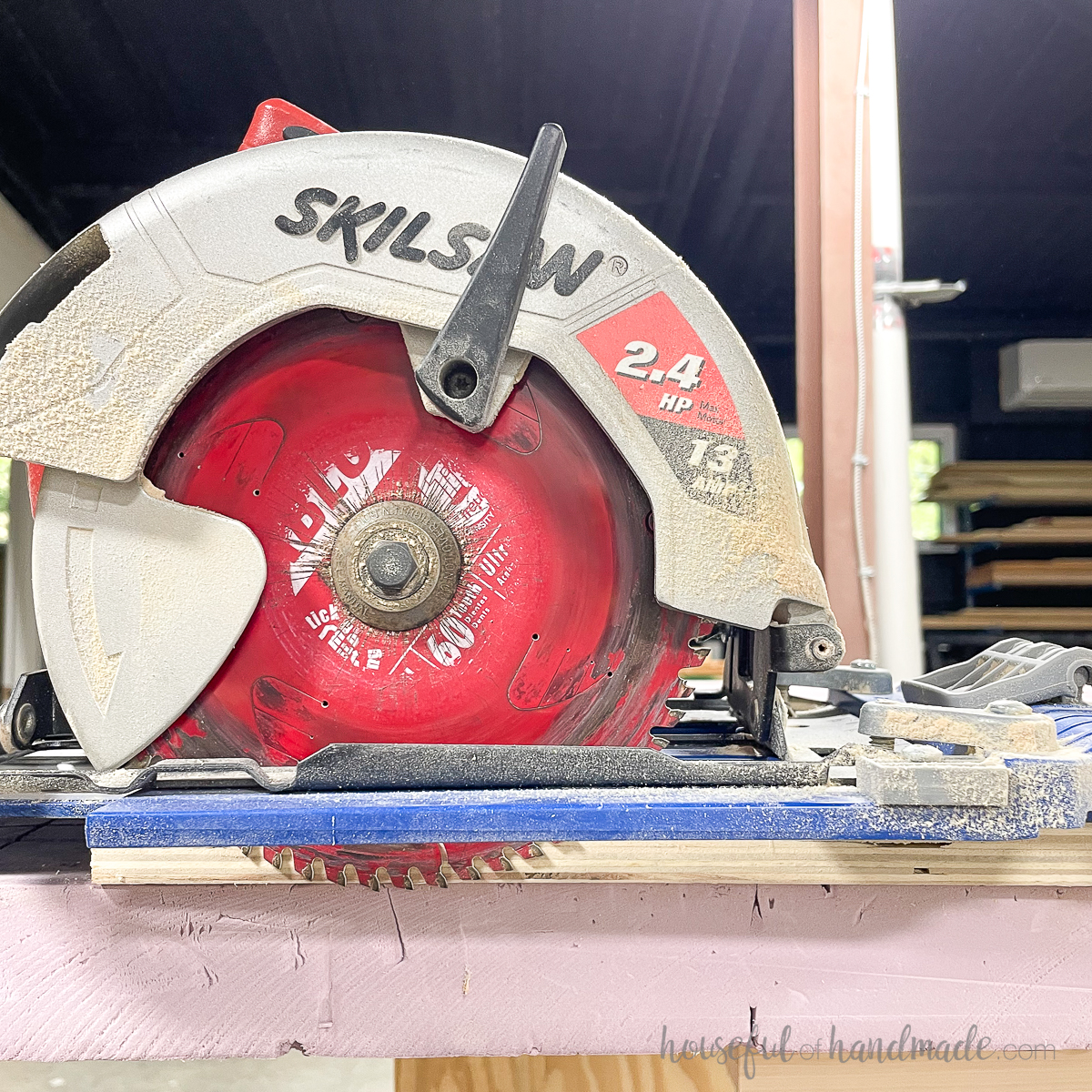 Circular saw on guide track with blade hanging off the end of the plywood to set blade depth. 