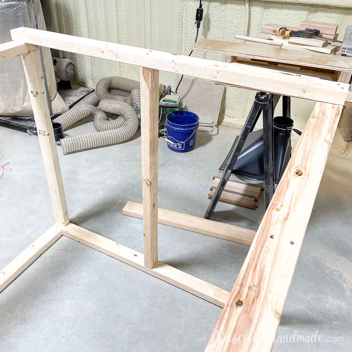 Adding center supports to the front and back of the coop frame. 