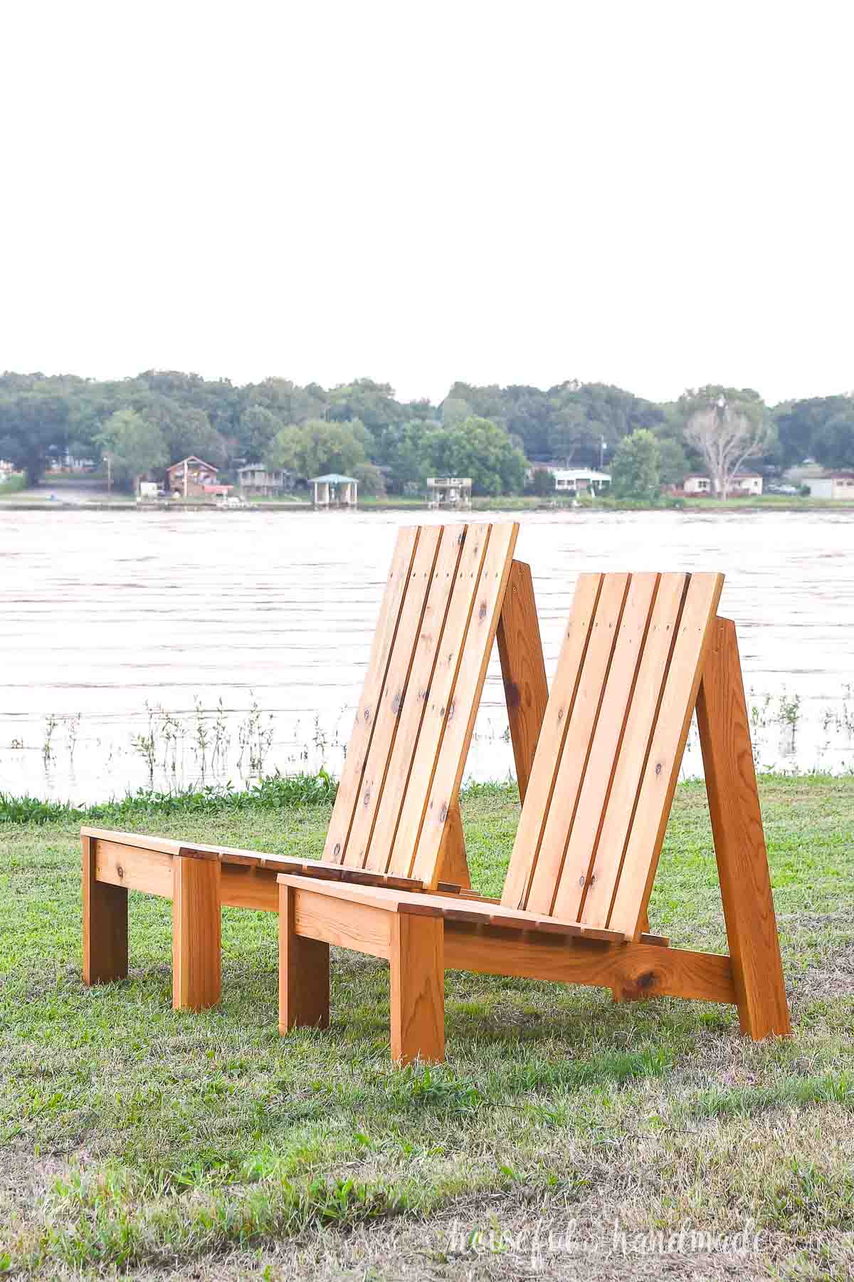 A regular and XL modern outdoor chair built from cedar sitting side by side.