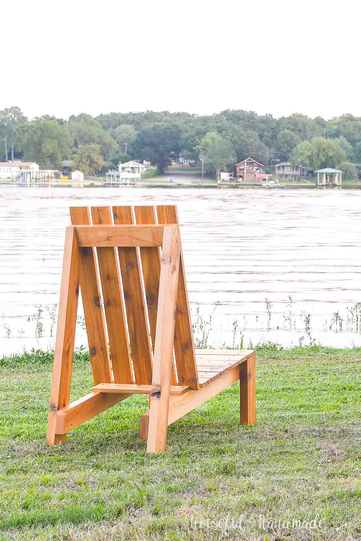 Back view of the larger outdoor chair looking over a lake. 