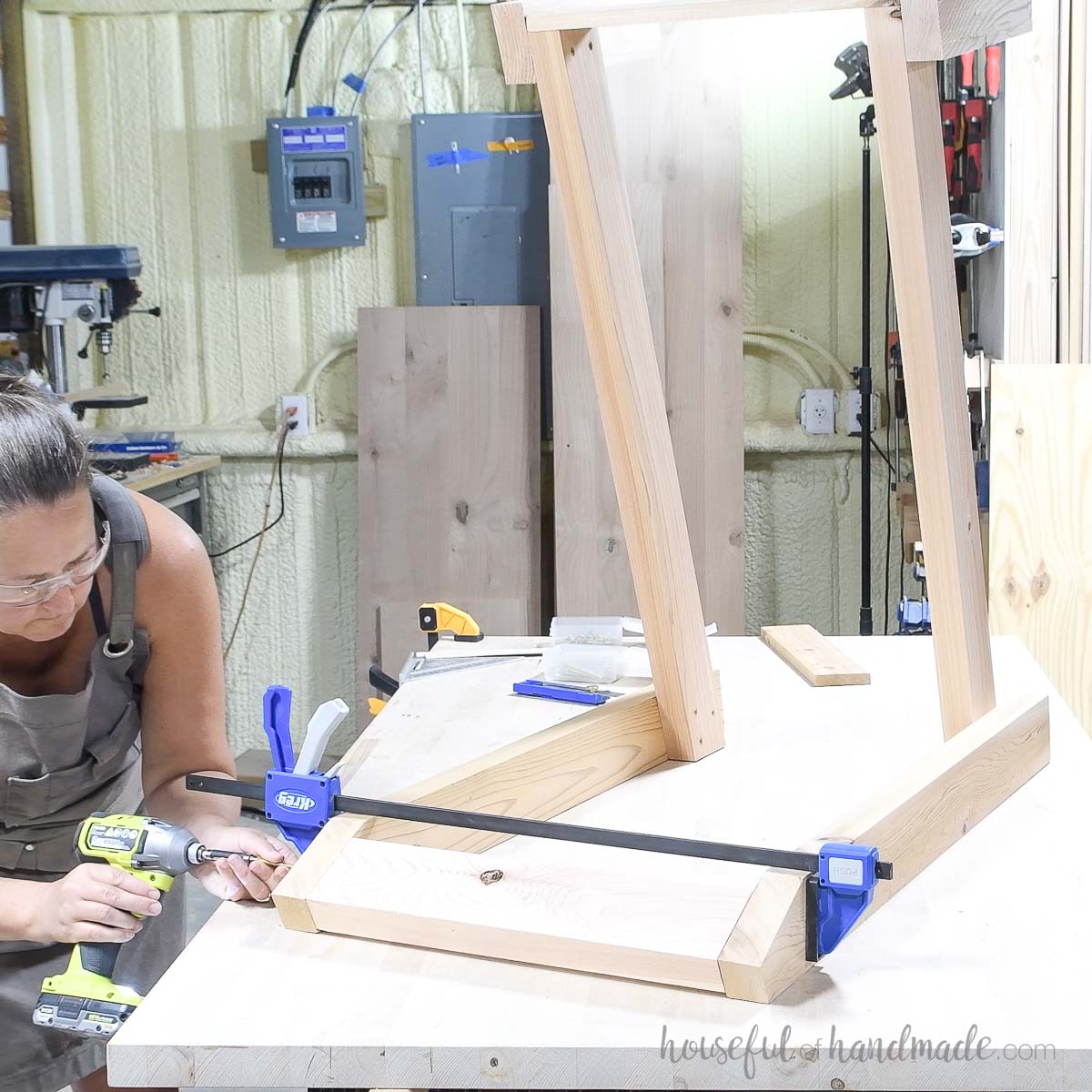 Securing the back piece on the large DIY outdoor chair. 