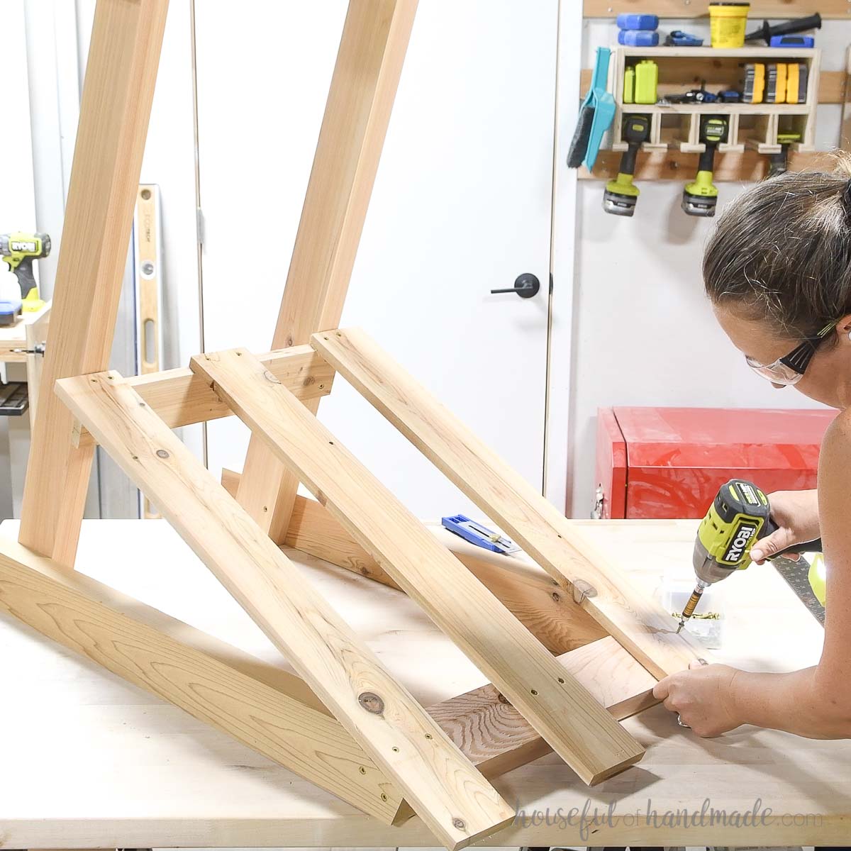 Securing the slats to the back of the chair. 