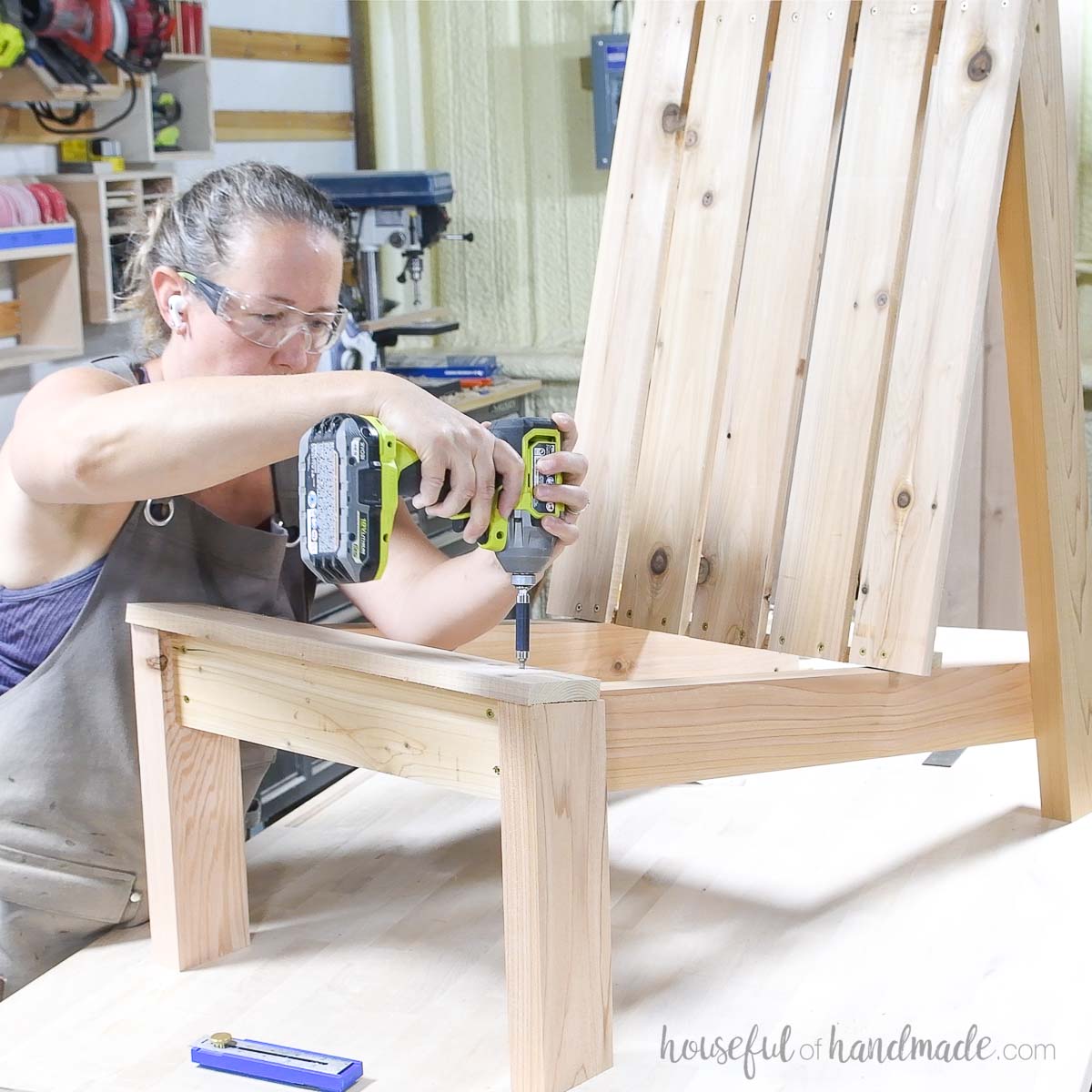 Attaching the front seat slat on the Adirondack chair. 