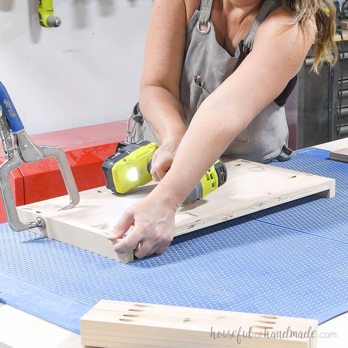 Attaching trim to the top and bottom of the plywood side. 