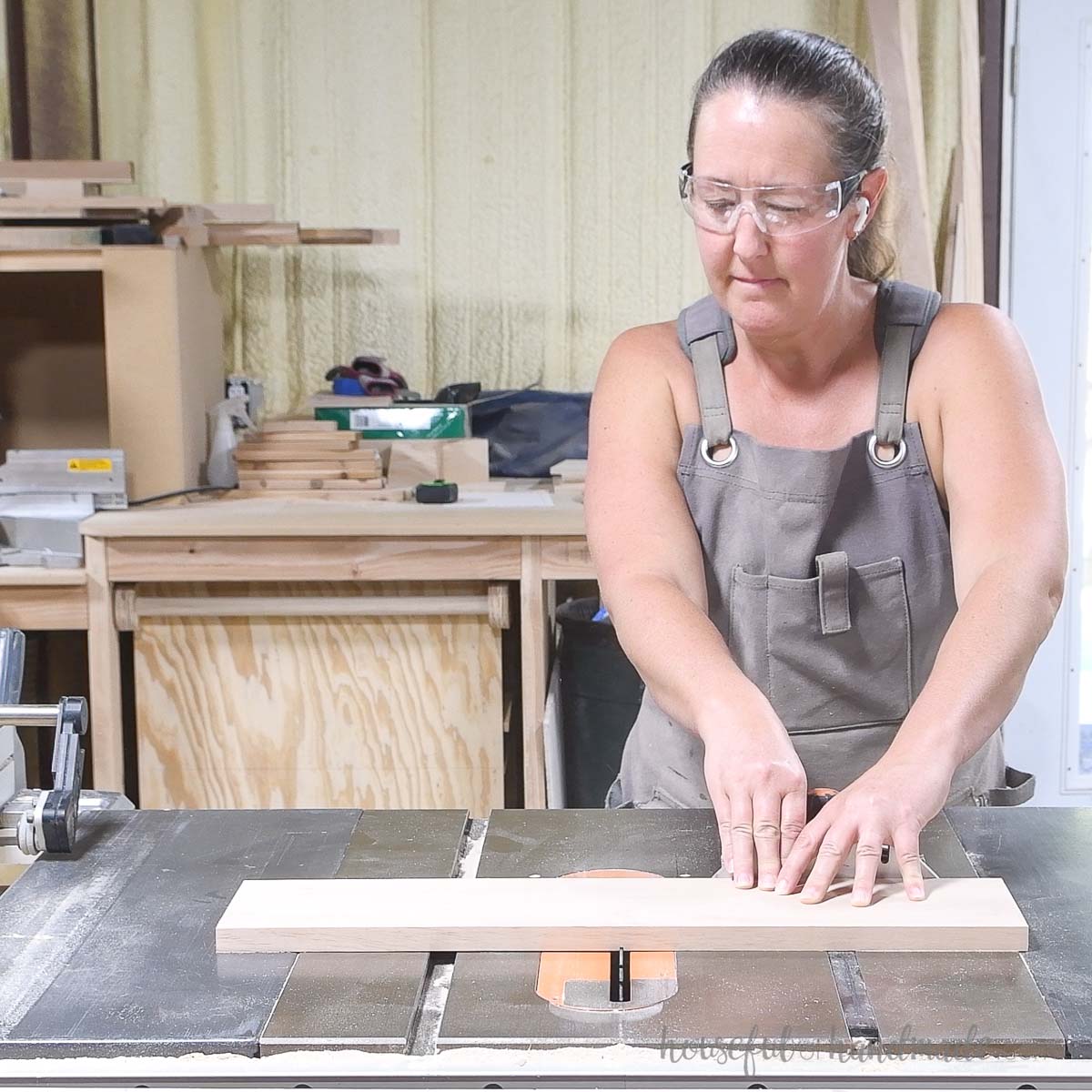 Cutting a shallow groove down the center of the drawer front piece. 