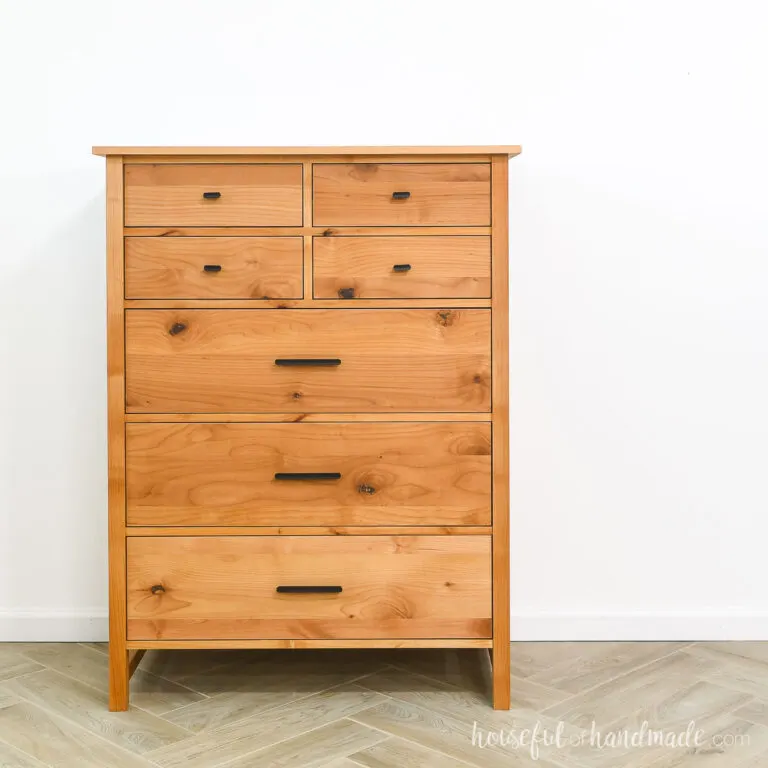 Tall DIY dresser with 4 small drawers and 3 large drawers made from alder wood.