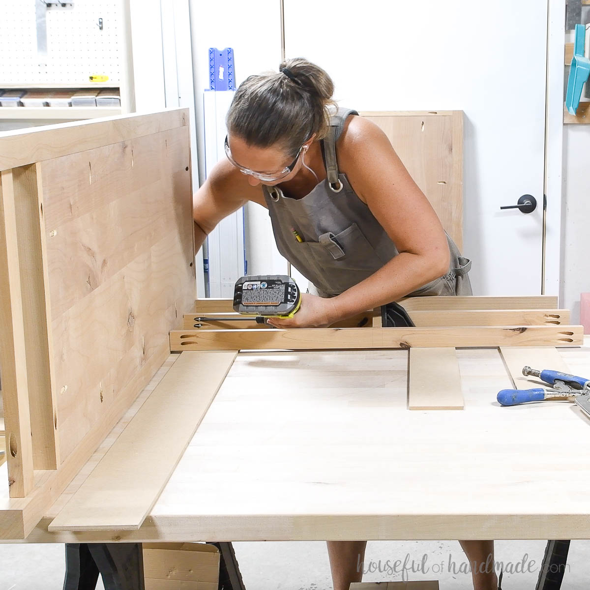 Attaching the front frame to the dresser side. 