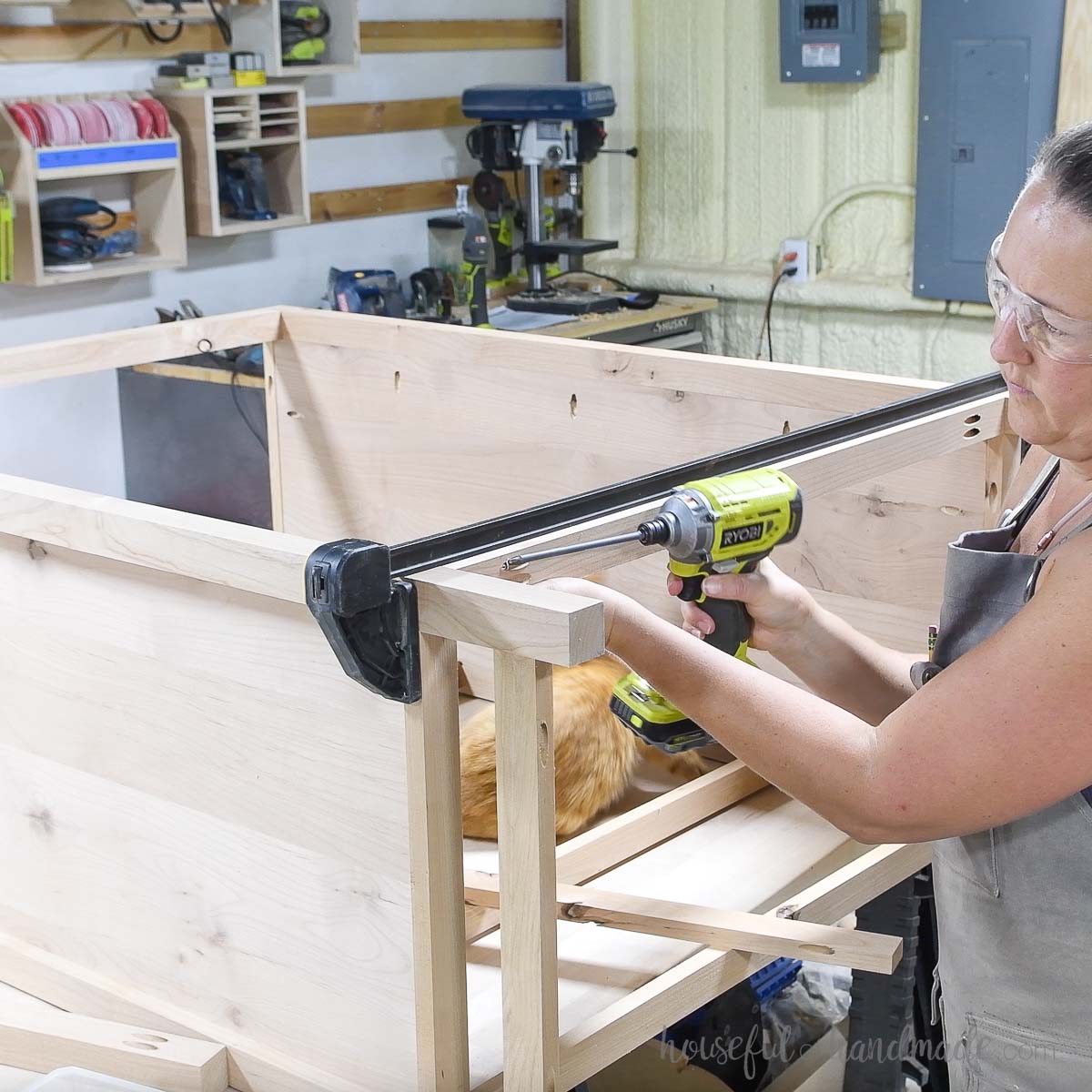 Attaching the back pieces to the dresser. 