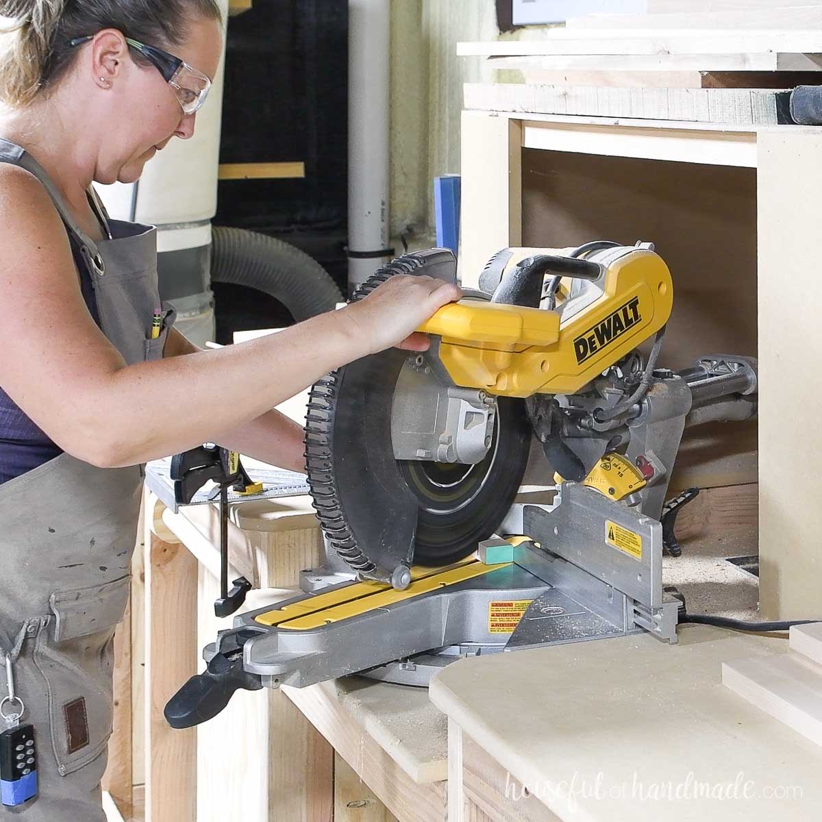 Cutting the front legs at an angle on the miter saw. 