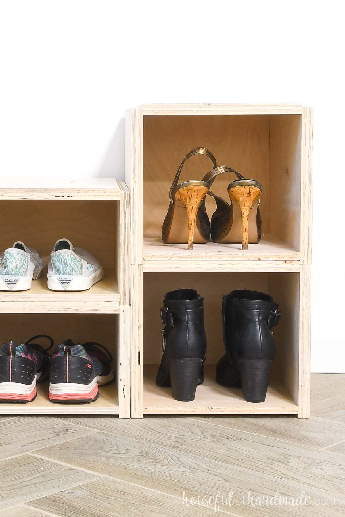 Close up of the small and medium stackable shoe storage boxes with shoes in them. 