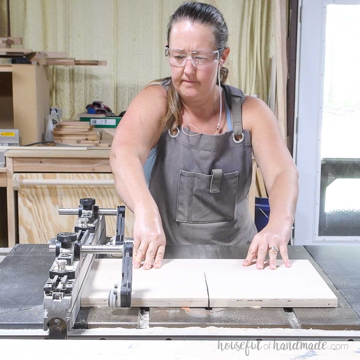 Cutting scraps of plywood on a table saw. 