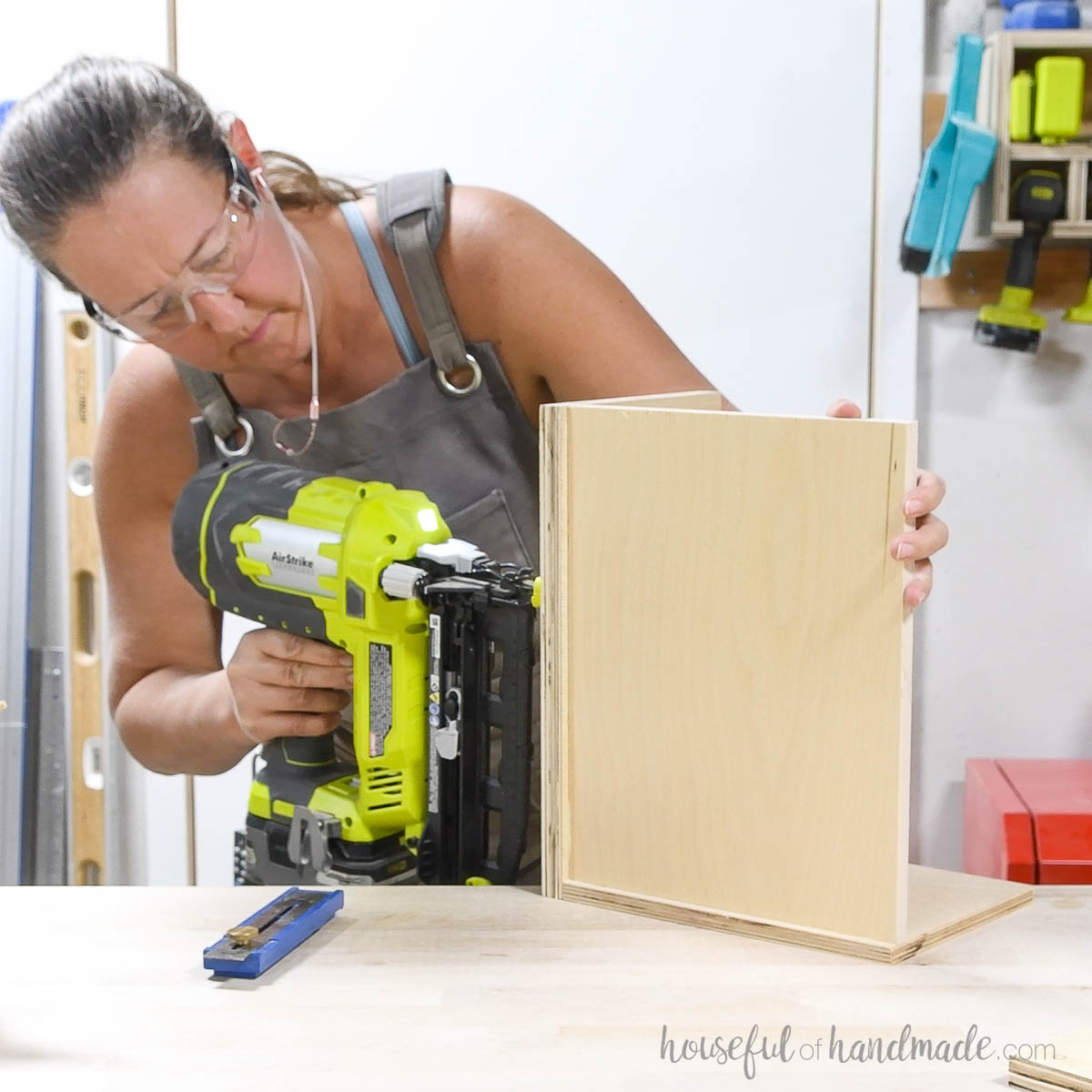 Nailing a bottom into the plywood box. 