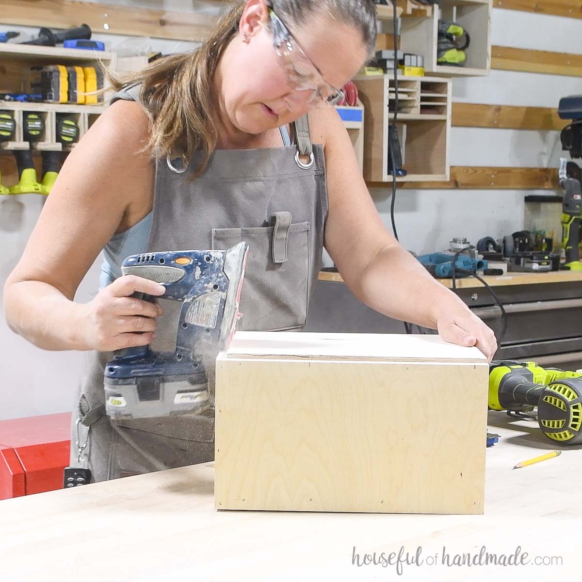 Sanding the lip on the top of the stacking boxes. 