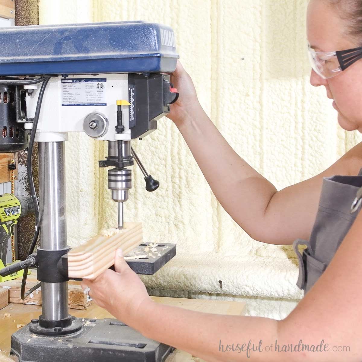 Drilling a hole on a drill press. 