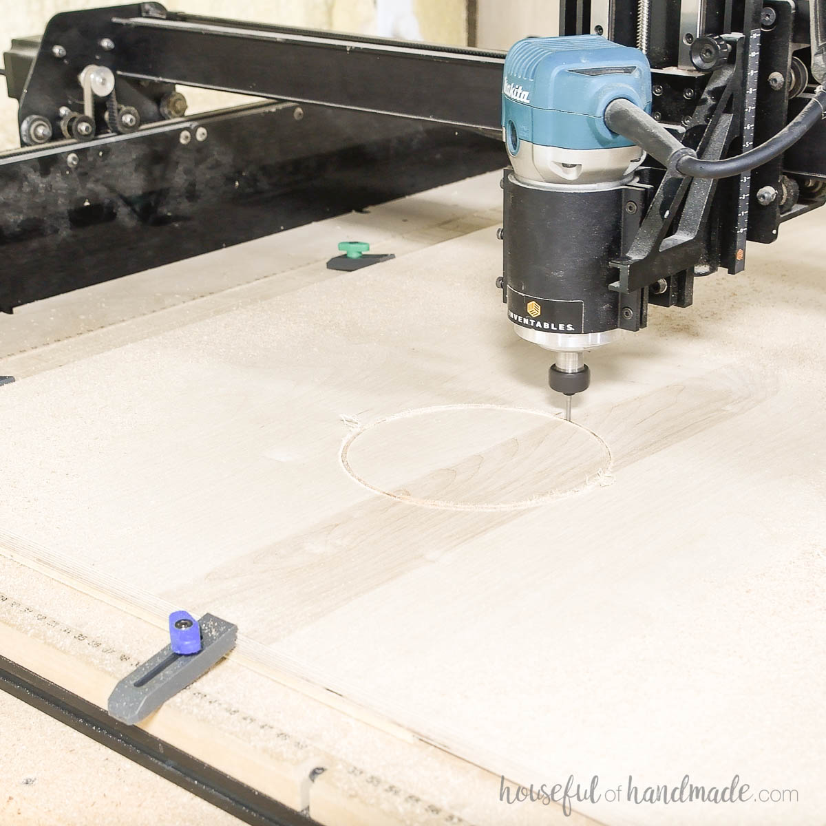 Cutting a circle into plywood with a CNC machine. 